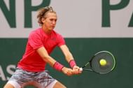 Sebastian Korda hits a backhand